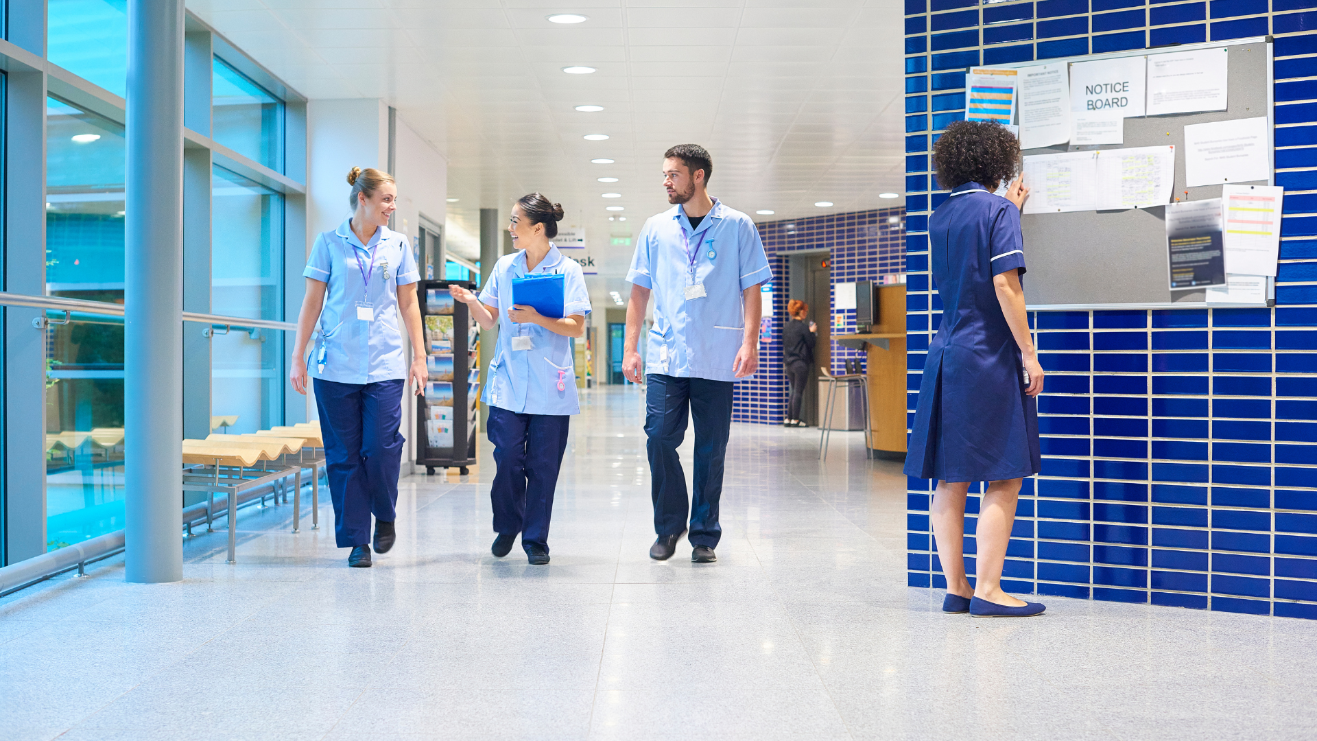 nursing staff walking in a hospital corridor