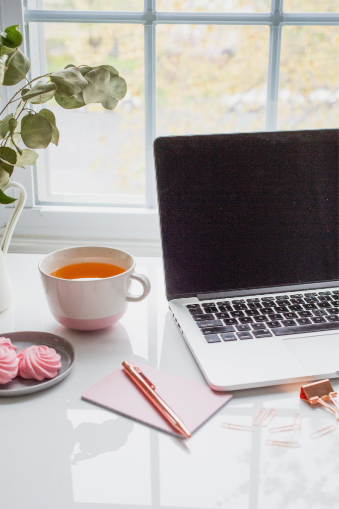 desk with computer and coffee