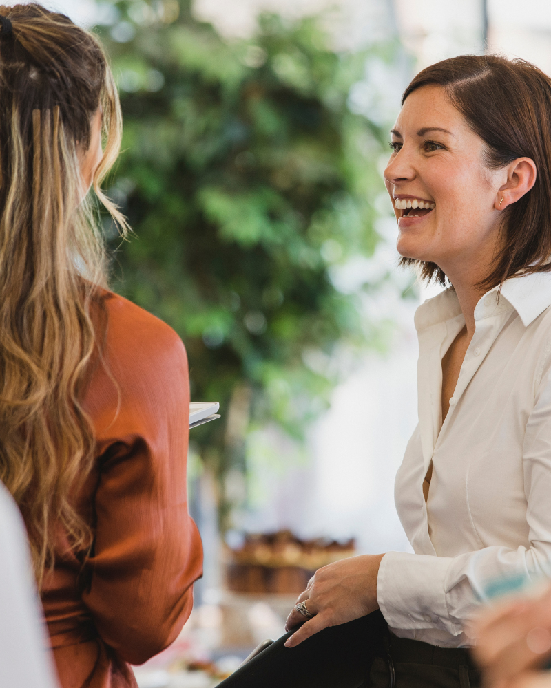 smiling business woman at work conversation for strategic growth